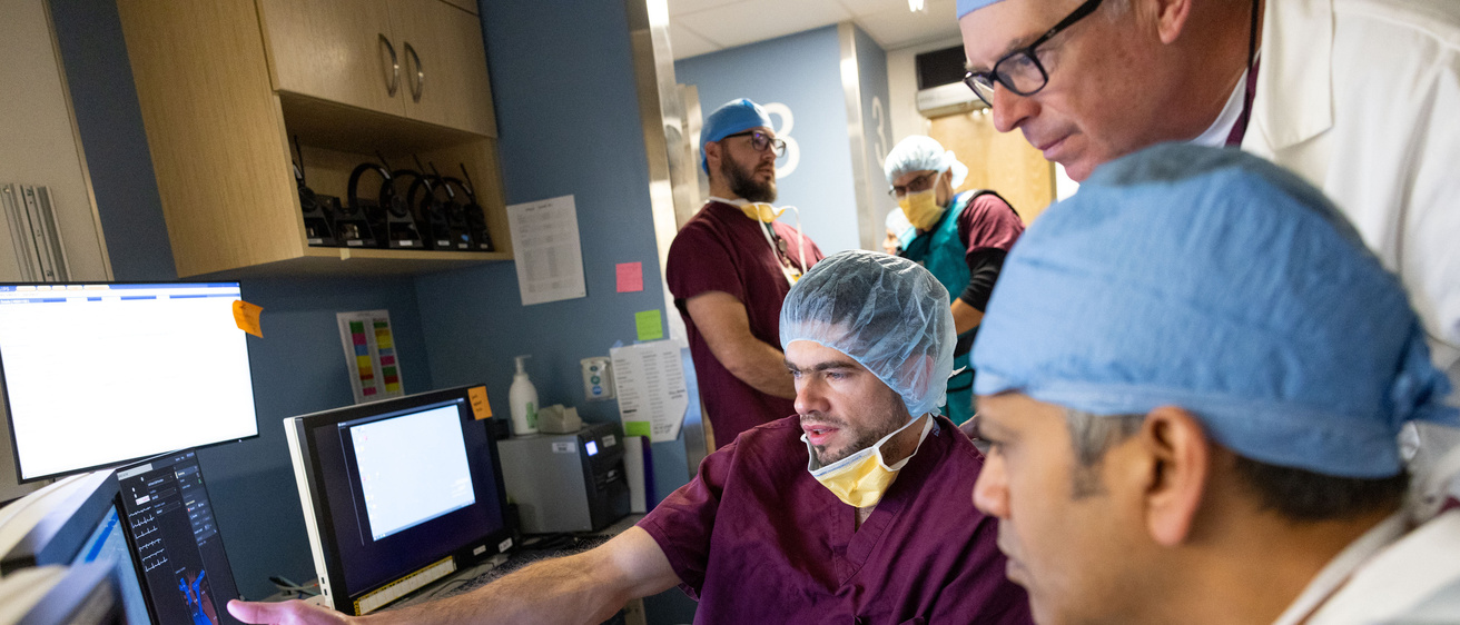 Cath lab collaboration photo between multiple doctors
